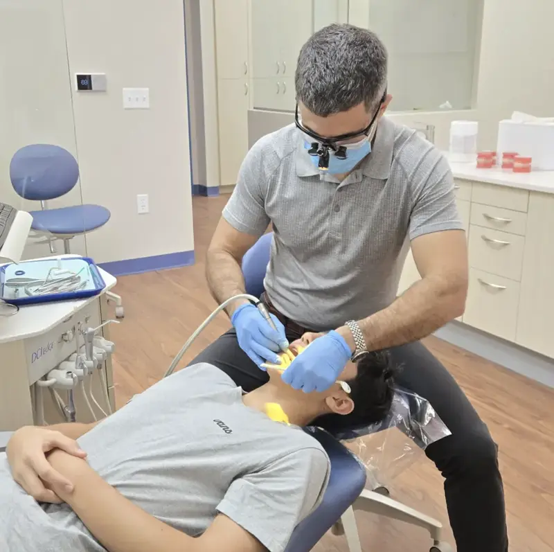 Dr. Komforti treating patient