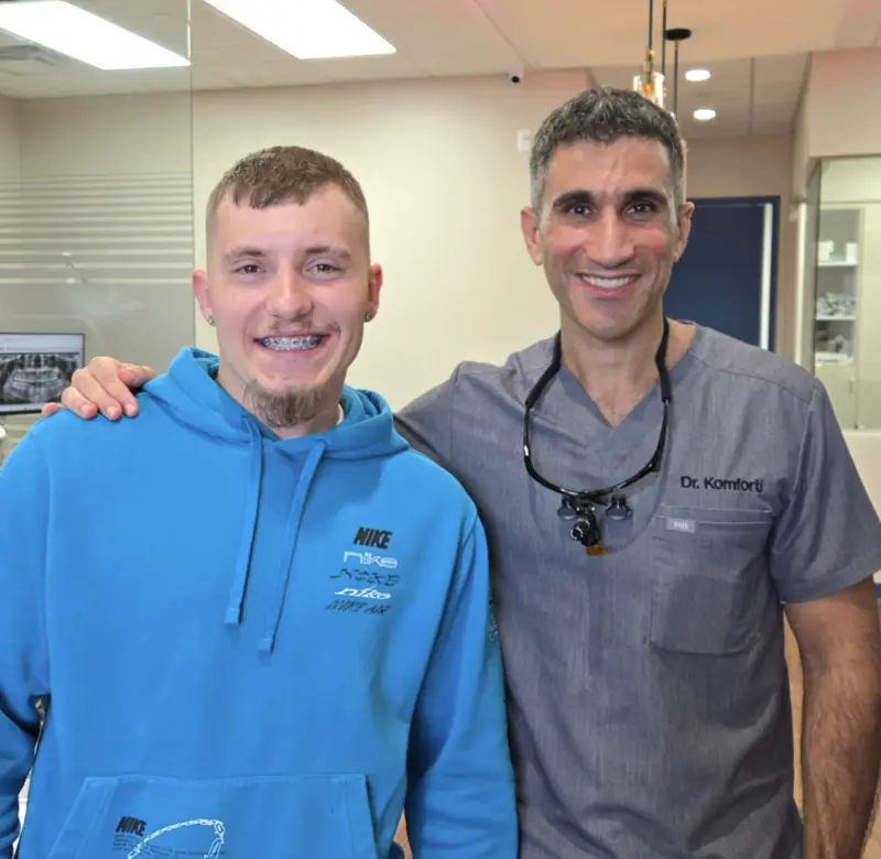 Dr. Komforti with teen patient
